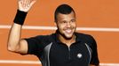 Jo-Wilfried Tsonga of France celebrates after beating Christian Lindell of Sweden during their men's singles match at the French Open tennis tournament at the Roland Garr