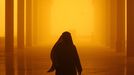 Saudi people walk through a sand and dust storm in Riyadh on March 10, 2009. A blinding dust and sand storm hit the Gulf region on March 10 with warnings of low visability coming from the Saudi meteorological authorities and Kuwait closing all three of their ports halting oil exports.