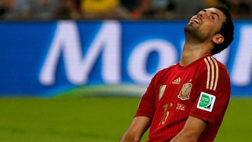 Spain's Sergio Busquets reacts after missing a chance to score a goal during their 2014 World Cup Group B soccer match against Chile at the Maracana stadium in Rio de Jan