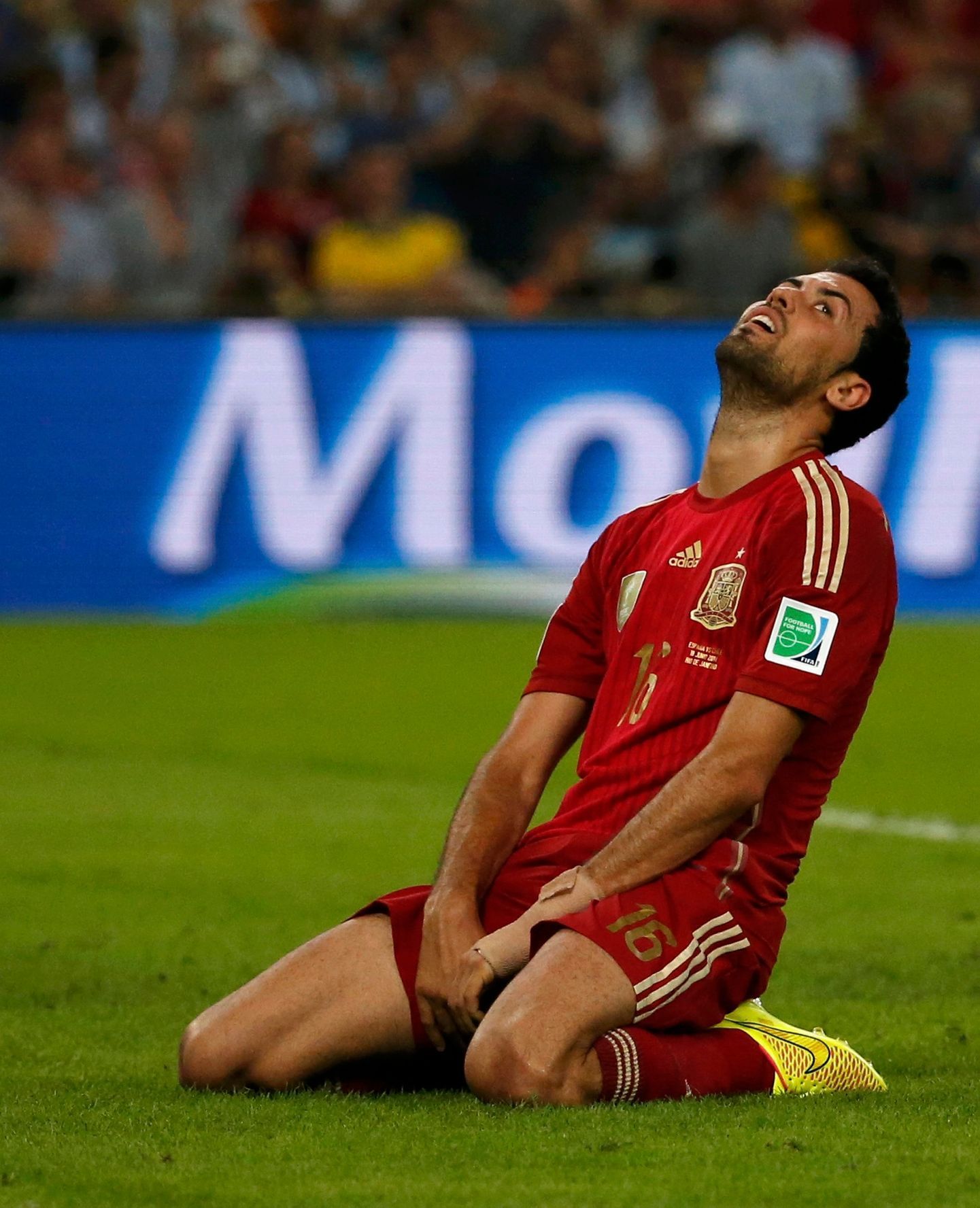 Spain's Sergio Busquets reacts after missing a chance to score a goal during their 2014 World Cup Group B soccer match against Chile at the Maracana stadium in Rio de Janeiro