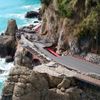 Firefighters work on the road connecting Santa Margherita Ligure to Portofino, partially collapsed following bad weather.
