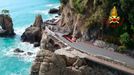 Firefighters work on the road connecting Santa Margherita Ligure to Portofino, partially collapsed following bad weather.