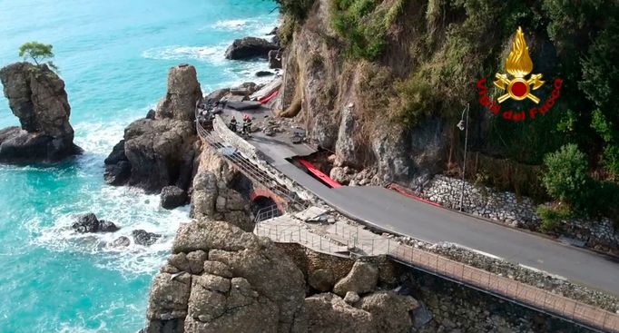 Firefighters work on the road connecting Santa Margherita Ligure to Portofino, partially collapsed following bad weather.