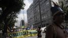 A Brazilian native Indian man leads a march of different social and political groups during a protest against both the privatization of the Maracana Stadium and the demolition of the Brazilian Indian Museum in Rio de Janeiro, March 16, 2013. A native Indian community of around 30 individuals, who have been living in the abandoned Indian Museum since 2006, were summoned to leave the Museum, which is next to the Maracana Stadium, in 72 hours by court officials on Friday, reported local media. REUTERS/Ricardo Moraes (BRAZIL - Tags: CIVIL UNREST SPORT SOCIETY POLITICS) Published: Bře. 16, 2013, 6 odp.