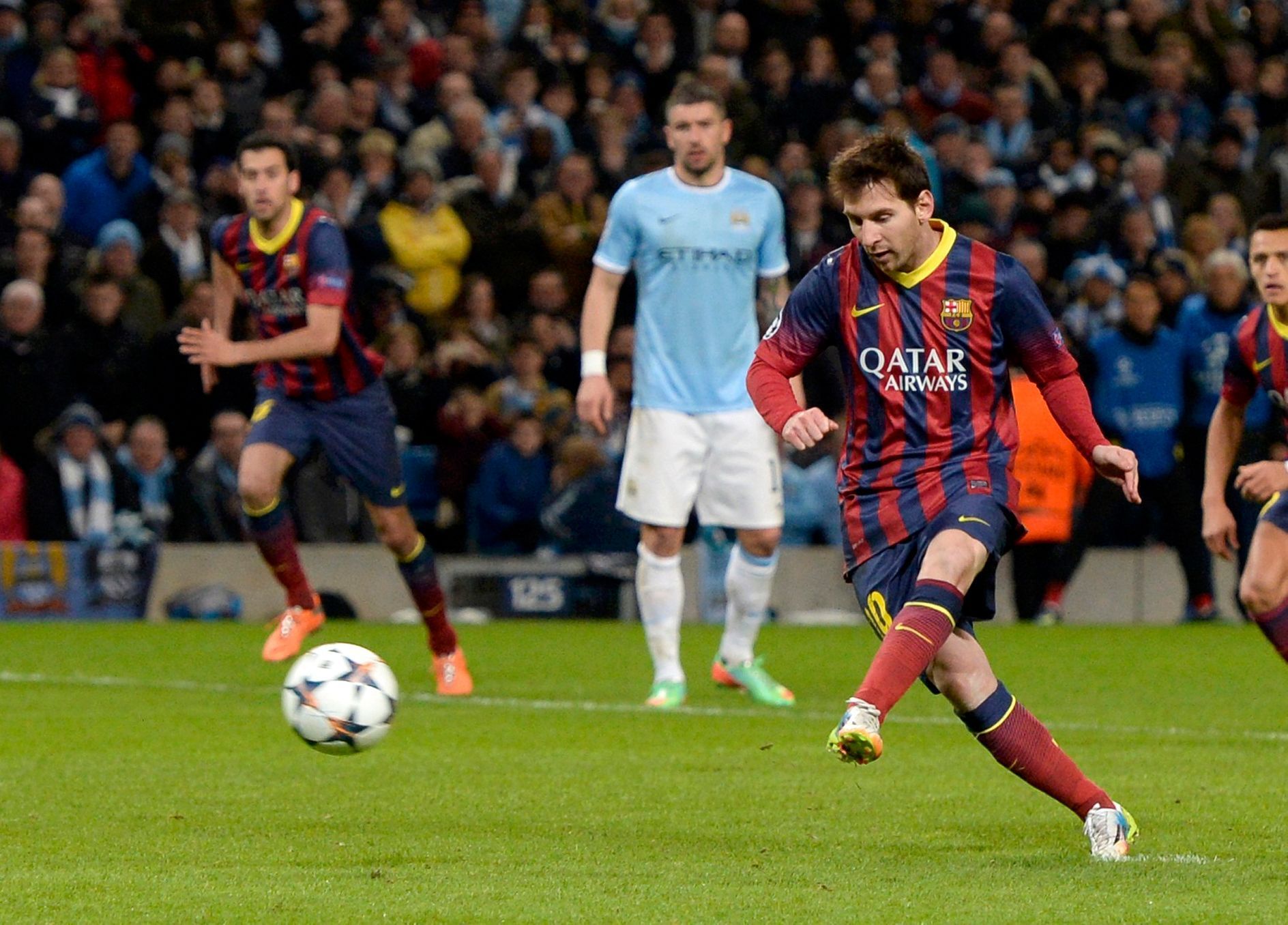 Barcelona's Lionel Messi scores a penalty against Manchester City during their Champions League round of 16 first leg soccer match at the Etihad Stadium in Manchester