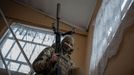 A Ukrainian Army sniper carries his rifle at a temporary base near a front line, amid Russia's attack on Ukraine, in Donetsk region, Ukraine December 23, 2023. REUTERS/Vi