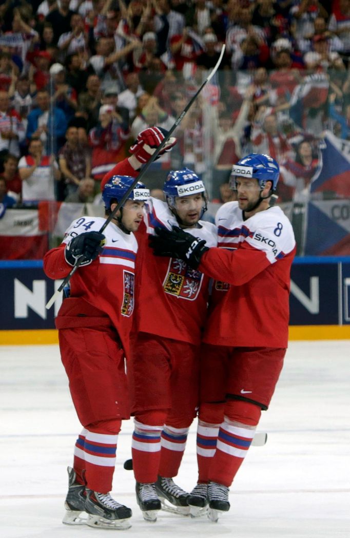 Ondrej Nemec of the Czech Republic celebrates his goal against Austria with team mates Dominik Simon (L) and Jan Hejda (R) during their Ice Hockey World Championship game