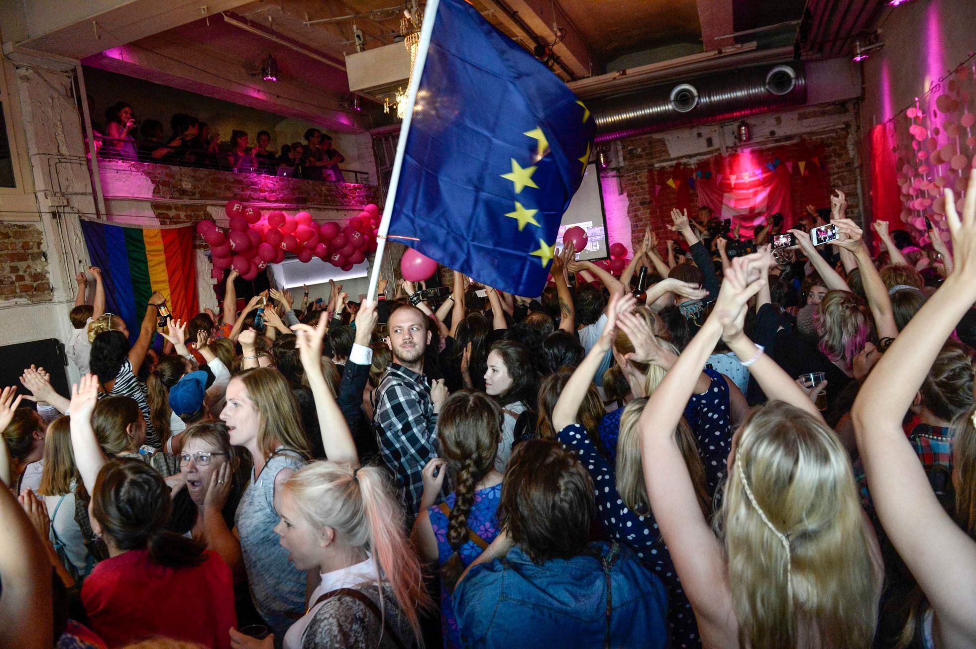 Party workers at the Swedish Feminist Initiative, celebrate to the exit polls that make the party Sweden's second biggest party in the European Parliament elections, in Stockholm
