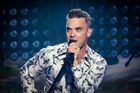 Recenze: Osobní texty, nadsázka a silné melodie dělají z novinky Robbieho Williamse vynikající album