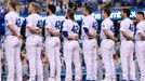 Apr 15, 2022; Los Angeles, California, USA; Los Angeles Dodgers players stand on the third base line for the National Anthem to celebrate the 75th anniversary of Jackie R