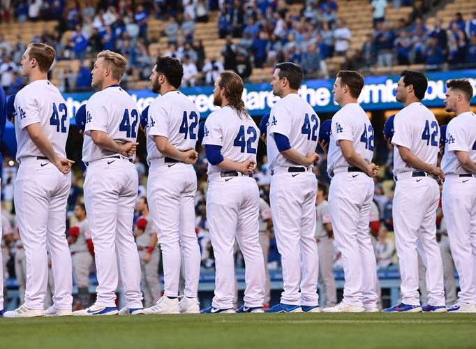 Apr 15, 2022; Los Angeles, California, USA; Los Angeles Dodgers players stand on the third base line for the National Anthem to celebrate the 75th anniversary of Jackie R