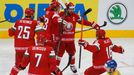 Geoff Platt of Belarus (R) celebrates with his team mates after scoring a goal against Sweden during the second period of their men's ice hockey World Championship quarte