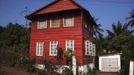 Painted wooden planks cover facade of traditional colonial-era Board House on King Street in Sierra Leone's capital Freetown