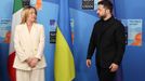 Italy's Prime Minister Giorgia Meloni and Ukraine's President Volodymyr Zelensky arrive to pose for a group photo within a meeting between the NATO Secretary General, the