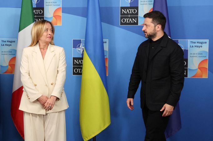 Italy's Prime Minister Giorgia Meloni and Ukraine's President Volodymyr Zelensky arrive to pose for a group photo within a meeting between the NATO Secretary General, the