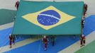 Performers carry the Brazilian flag during the 2014 World Cup opening ceremony at the Corinthians arena in Sao Paulo June 12, 2014. REUTERS/Fabrizio Bensch (BRAZIL - Tags