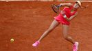 Eugenie Bouchard of Canada serves to Carla Suarez Navarro of Spain during their  women's quarter-final match at the French Open Tennis tournament at the Roland Garros sta