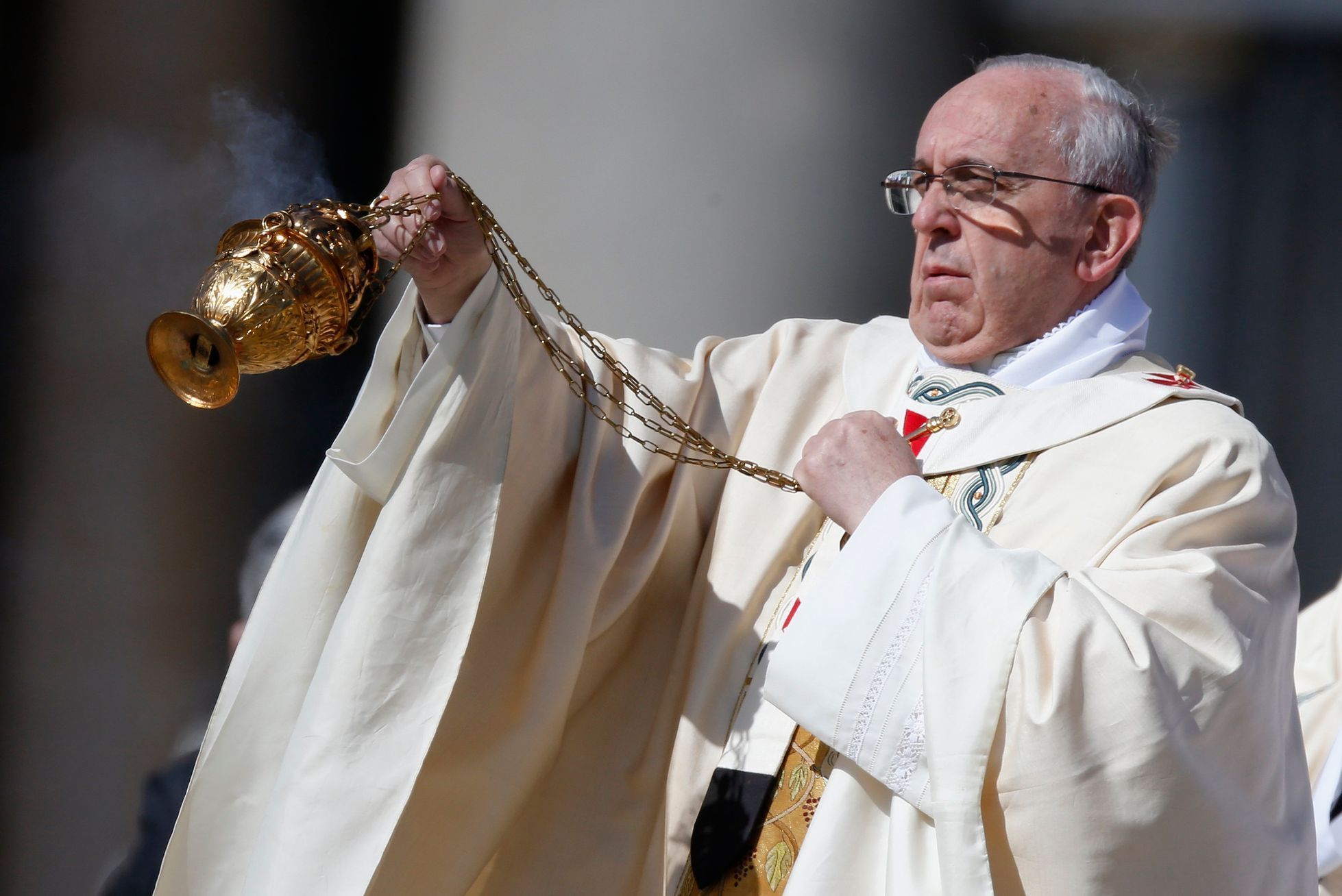 Pope Francis uses incense burner as he leads the Easter mass in Saint Peter's Square at the Vatican