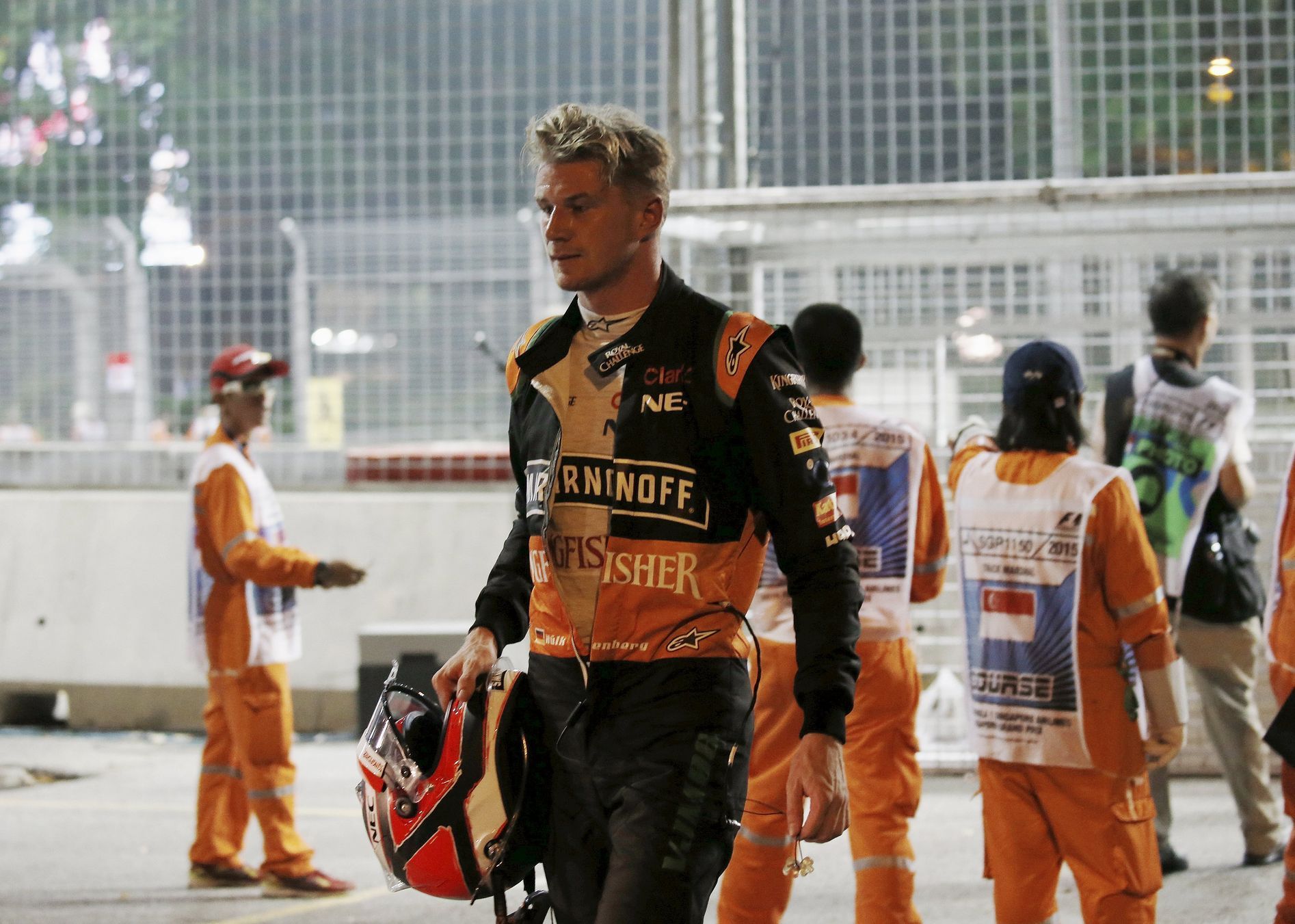 Force India Formula One driver Hulkenberg of Germany walks from the track after crashing during the Singapore F1 Grand Prix