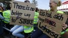 Members of German air carrier Lufthansa cabin crew union "UFO" hold placards outside a Lufthansa office building at the Fraport airport in Frankfurt, September 4, 2012. Lufthansa passengers face widespread flight disruption after cabin crew representatives said they continue a series of strikes over pay and cost-cutting measures at Germany's largest airline. The UFO union, which represents around two-thirds of Lufthansa's 19,000 cabin crew, late on Thursday called on its members to strike on Tuesday in Frankfurt and Berlin. REUTERS/Kai Pfaffenbach (GERMANY - Tags: BUSINESS EMPLOYMENT CIVIL UNREST TRANSPORT)