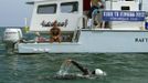 Team leader Bonnie Stoll, left, watches endurance swimmer Diana Nyad as she trains off Key West, Florida, August 13, 2012. Nyad, who turns 63 on August 22nd, plans to begin her fourth attempt to swim from Havana, Cuba, to the Florida Keys on Sunday, August 19, 2012. She says that severe jellyfish stings thwarted her third attempt and plans to wear the new suit during night time swimming. Photo taken August 13, 2012. REUTERS/Presley Adamson/Florida Keys News Bureau/Handout (UNITED STATES - Tags: SOCIETY) NO SALES. NO ARCHIVES. FOR EDITORIAL USE ONLY. NOT FOR SALE FOR MARKETING OR ADVERTISING CAMPAIGNS. THIS IMAGE HAS BEEN SUPPLIED BY A THIRD PARTY. IT IS DISTRIBUTED, EXACTLY AS RECEIVED BY REUTERS, AS A SERVICE TO CLIENTS Published: Srp. 16, 2012, 9:15 odp.