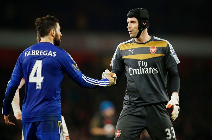 Chelsea's Cesc Fabregas with Arsenal's Petr Cech