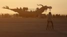 Participants watch the sunrise from an art car during the Burning Man 2012 "Fertility 2.0" arts and music festival in the Black Rock Desert of Nevada, August 29, 2012. More than 60,000 people from all over the world have gathered at the sold out festival, which is celebrating its 26th year, to spend a week in the remote desert cut off from much of the outside world to experience art, music and the unique community that develops.