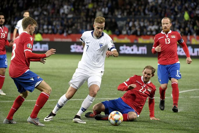 Soccer Football - Euro 2020 - Group J Qualification - Finland v Liechtenstein - Helsinki, Finland November 15, 2019. Jasse Tuominen of Finland vies with Max Goppel, Marti