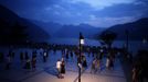 Residents dance at a square next to the Yangtze River in Badong city, 100km (62 miles) from the Three Gorges dam in Hubei province in this August 8, 2012 file photo. China relocated 1.3 million people during the 17 years it took to complete the Three Gorges dam. Even after finishing the $59 billion project last month, the threat of landslides along the dam's banks will force tens of thousands to move again. It's a reminder of the social and environmental challenges that have dogged the world's largest hydroelectric project. While there has been little protest among residents who will be relocated a second time, the environmental fallout over other big investments in China has become a hot-button issue ahead of a leadership transition this year. Picture taken on August 8, 2012. To match story CHINA-THREEGORGES/ REUTERS/Carlos Barria/Files (CHINA - Tags: POLITICS ENVIRONMENT BUSINESS ENERGY TPX IMAGES OF THE DAY) Published: Srp. 22, 2012, 8:36 odp.