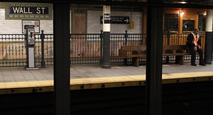 A Metropolitan Transportation Authority (MTA) employee waits for one of the last downtown 4 subway trains in New York October 28, 2012. Hurricane Sandy, which could become the largest storm ever to hit the U.S., is set to bring much of the East Coast, including New York and Washington, to a virtual standstill in the next few days with battering winds, flooding and the risk of widespread power outages. New York and other cities and towns closed their transit systems and schools and ordered residents of low-lying areas to evacuate before a storm surge that could reach as high as 11 feet (3.4 meters). REUTERS/Carlo Allegri (UNITED STATES - Tags: TRANSPORT ENVIRONMENT DISASTER TPX IMAGES OF THE DAY)