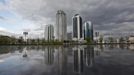 The skyscrapers of the Grozny city complex are seen in the Chechen capital Grozny April 27, 2013. The naming of two Chechens, Dzhokhar and Tamerlan Tsarnaev, as suspects in the Boston Marathon bombings has put Chechnya back on the world's front pages, Chechnya appears almost miraculously reborn. The streets have been rebuilt. Walls riddled with bullet holes are long gone. New high rise buildings soar into the sky. Spotless playgrounds are packed with children. A giant marble mosque glimmers in the night.Yet, scratch the surface and the miracle is less impressive than it seems. Behind closed doors, people speak of a warped and oppressive place, run by a Kremlin-imposed leader through fear. Picture taken April 27, 2013. REUTERS/Maxim Shemetov (Russia - Tags: SOCIETY POLITICS CITYSCAPE) ATTENTION EDITORS: PICTURE 20 OF 40 FOR PACKAGE 'INSIDE MODERN CHECHNYA'. SEARCH 'REBUILDING CHECHNYA' FOR ALL IMAGES Published: Kvě. 1, 2013, 6:52 dop.