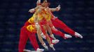 Chinese gymnast Teng Haibin works out on the horizontal bar during men's gymnastics podium training before the 2012 London Olympic Games in London July 25, 2012. Picture taken using multiple exposures. REUTERS/Mike Blake (UNITED KINGDOM - Tags: SPORT OLYMPICS GYMNASTICS TPX IMAGES OF THE DAY) Published: Čec. 25, 2012, 1:12 odp.