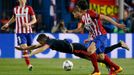 Bayern Munich's Robert Lewandowski in action with Atletico Madrid's Antoine Griezmann and Stefan Savic