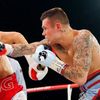 World champion Golovkin of Kazakhstan punches Murray of England during the WBA-WBC-IBO Middleweight World Championship in Monte Carlo