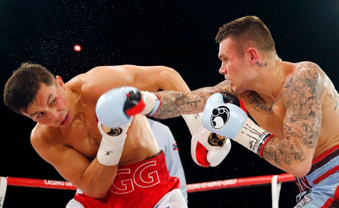 World champion Gennadiy Golovkin of Kazakhstan (L) punches Martin Murray of England during the WBA-WBC-IBO Middleweight World Championship in Monte Carlo, early February