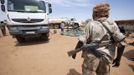 A member of the rebel movement Sudan Liberation Army (SLA) - Abdul Wahid, escorts the delivery of 30,000 litres of water in Forog