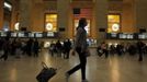 A woman pulls her luggage at Grand Central Station while Hurricane Sandy approaches New York, October 28, 2012. Tens of millions of East Coast residents scrambled on Sunday to prepare for Hurricane Sandy, which could make landfall as the largest storm to hit the United States, bringing battering winds, flooding and even heavy snow. REUTERS/Eduardo Munoz (UNITED STATES - Tags: ENVIRONMENT DISASTER)