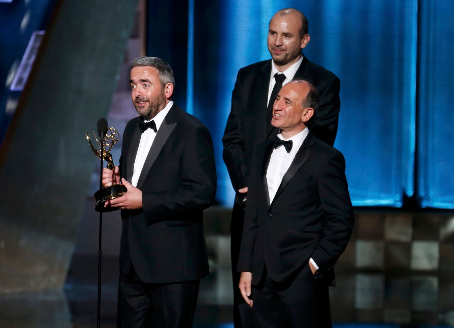 Blackwell accepts the award for Outstanding Writing For A Comedy Series for their work on HBO's &quot;Veep&quot; as fellow writers Iannucci and Roche listen at the 67th Primetime Emmy Awards in Los An