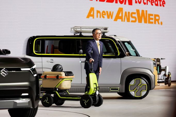 President and Representative Director at Suzuki Motor Corporation Toshihiro Suzuki unveils the SUZU-RIDE at a press day of the Japan Mobility Show 2023 at Tokyo Big Sight