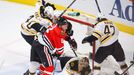 Boston Bruins goalie Tuukka Rask lies on the ice after the puck passed the goal line as teammates Torey Krug (R), Dennis Seidenberg and David Krejci (L) attempt to clear