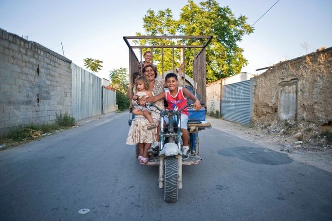 28 Titulek: Gypsy slums of Greece Popis: September 16, 2011, Tavros, Athens/Attica, Greece: Almost 30,000 Gypsies or "Roma" from Albania and Bulgaria enter Greece in the last two years. Since 1998, one thousand Roma have lived in a slum in the Votanicos area, of the Tavros municipality of Athens. Their 600 children aged from infants to 15 years old, live under unhealthy conditions in the garbage strewn township where the Roma survive by stealing or collecting metal garbage to sell. The Roma burn cables to extract the copper inside, which creates a toxic cloud from cancerous dioxines that hangs over their shantytown. While shantytowns are less common in Europe, the growing influx of illegal immigrants have fueled shantytowns in cities commonly used as a points of entry into the EU, including Athens. In October 2013, an unidentified girl, called "Maria," was found in a Greek gypsy camp and could be related to missing child cases. Over 8,000 calls about the girl from all over the world including the U.S. and Canada have been received inquiring about the child. The blond girl, approximately age 4, was found in a Roma gypsy settlement in central Greece. DNA tests proved that she was not related to the 39-year-old man and 40-year-old woman who claimed to be her parents.