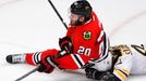 Chicago Blackhawks' Brandon Saad (20) falls on Boston Bruins' Dennis Seidenberg during the second period in Game 2 of their NHL Stanley Cup Finals hockey series in Chicag