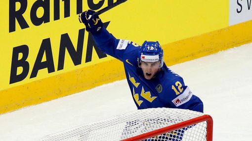 Sweden's Joakim Lindstrom celebrates his goal as Canada's goalie Ben Scrivens (R) reacts during the first period of their men's ice hockey World Championship Group A game