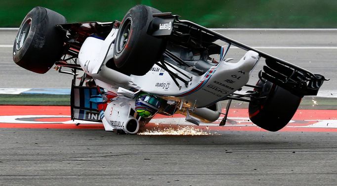 Williams Formula One driver Felipe Massa of Brazil crashes with his car in the first corner after the start of the German F1 Grand Prix at the Hockenheim racing circuit,