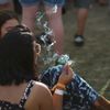 A concertgoer smokes marijuana at the Coachella Valley Music and Arts Festival in Indio, California