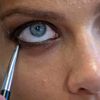 Model has her makeup applied before the Diane von Furstenberg Spring/Summer 2015 collection show during New York Fashion Week in the Manhattan borough of New York