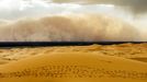 Trekkers Caught In Sandstorm - (Pictured is the sandstorm rising) These unbelievable pictures capture the moment camel trekkers are caught in a sandstorm while crossing the Erg Chebbi Desert. They were taken by photographer, Peter Vruggink, while he was on holiday with his family in Morocco in April. The huge wall of sand which can be seen in the distance coming over the land looks like something that would only be seen in a film.