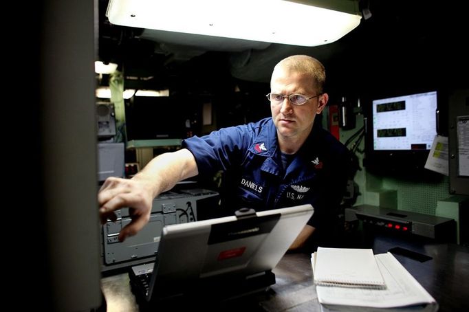 April 24, 2011 - Cape Canaveral, Florida, U.S. - -- Cape Canaveral, Fla. -- Scott Daniels, Electronics Technician First Class, of Fulton, New York, navigates the USS Annapolis (SSN 760), a S6G nuclear reactor powered fast attack submarine, sailing from Port Canaveral in Cape Canaveral on Sunday. The USS Annapolis measures 362 ft. in length and 33 ft. at the beam, a diving depth of over 400 ft., 27+ mph, 12 vertical launch missile tubes, 4 torpedo tubes, and a crew of 130 enlisted submariners. The submarine was commissioned April 11, 1992 with its homeport in Groton, Connecticut. USS Annapolis sailed to the 21st Anniversary of Fleet Week at Port Everglades, Fort Lauderdale. (Credit Image: © Gary Coronado/The Palm Beach Post)