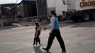 Cole Brothers Circus of the Stars performer German Fassio works with a dog backstage before the start of the first show in Myrtle Beach, South Carolina, March 31, 2013. Traveling circuses such as the Cole Brothers Circus of the Stars, complete with its traveling big top tent, set up their tent city in smaller markets all along the East Coast of the United States as they aim to bring the circus to rural areas. The Cole Brothers Circus, now in its 129th edition, travels to 100 cities in 20-25 states and stages 250 shows a year. Picture taken March 31, 2013. REUTERS/Randall Hill (UNITED STATES - Tags: SOCIETY ENTERTAINMENT ANIMALS) Published: Dub. 1, 2013, 7:01 odp.