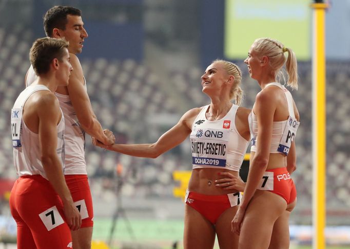 Athletics - World Athletics Championships - Doha 2019 - Mixed 4x400 Metres Relay Final - Khalifa International Stadium, Doha, Qatar - September 29, 2019 Team Poland react